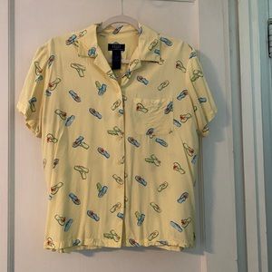 Yellow blouse with flip flops